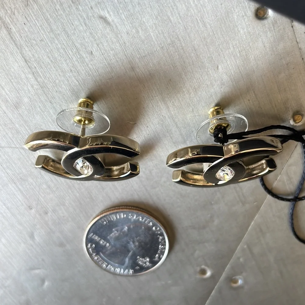 Chanel oversize gold logo earrings with crystal center with box